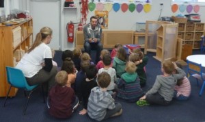 Duncan from Leaf Root and Fruit in the Kindergarten classroom discussing vegetable gardening