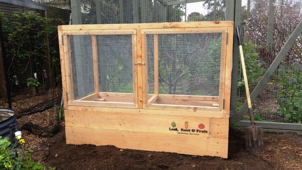 Raised Garden Bed With A Durable Cage To Keep Out Rats And Possums