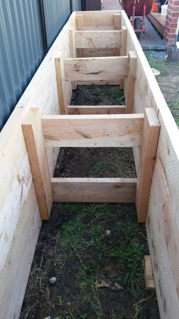 alongraisedgardenbedshowingbracing Leaf, Root & Fruit Gardening